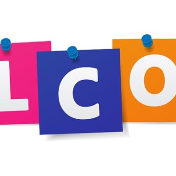 The word 'welcome' is made up of each letter on a brightly-coloured card, hanging on a washing line held with blue pegs.